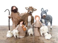 there is a group of figurines made out of felt and wool with sheep