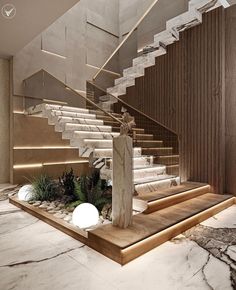 an elegant staircase with marble steps leading up to the second floor and plants on the other side