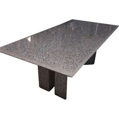 an image of a table that is made out of granite and has a triangular shape