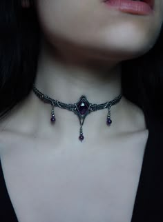 This one of a kind choker features a deep purple faceted amethyst in sterling silver wire, finished with your choice length of sterling silver chain for ease of adjustment. design © Dream Residue Jewelry Each order arrives packaged with a list of healing properties and jewelry care info. I always update my instagram first, follow me to shop my story sales for exclusive items: @DreamResidueJewery If you have any questions at all, or would like more photos or a video- please message me before purchasing. Custom orders are available! Choose your crystal or send me your own special crystal/item, discuss design, pick your wire, and choose your budget. Message me for more info or to start yours. Night Court Jewelry, Wire Wrap Choker, Wire Wrapped Choker, Goth Wedding Jewelry, Victorian Gothic Jewelry, Vampire Jewelry, Gothic Jewellery, Purple Accessories, Elven Jewelry