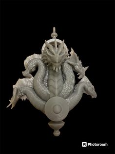 a white dragon statue sitting on top of a pedestal