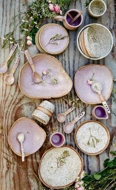 a table topped with lots of plates and bowls