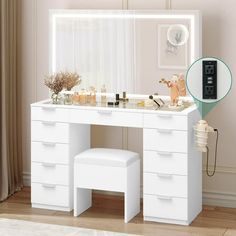 a white dressing table with mirror and stools in front of it, next to a window