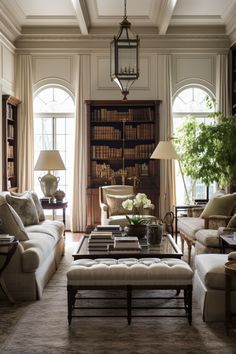 a living room filled with furniture and bookshelves