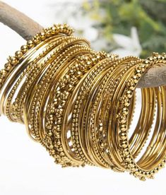 If you are someone fond of beautifying oneself and especially in love with wearing bangles, then you are at the right spot. We have brought in an exact range of party wear bangles and casual wear bangles with an exotic variety to pick from. Grab the beautiful set of bangles for the most important occasion of your life. Gift it to your mother, sister, friend or wife and make their special day more special. Golden Bangles Simple, Golden Chudi Set, Gold Traditional Bangles, Golden Bangles Set, Gold Bohemian Stackable Bangle, Bohemian Gold Stackable Bangle, Bohemian Stackable Gold Bangle, Gold Bangle For Festival, Gold Round Bracelets For Festival