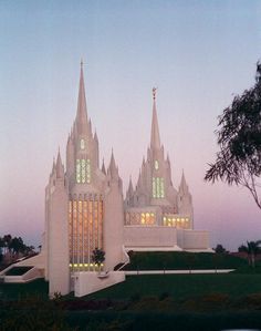 an image of a church that looks like it is built in the evening time with lights on