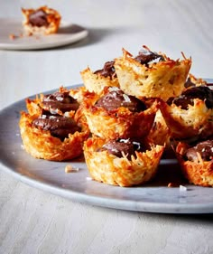 a plate filled with mini chocolate covered muffins