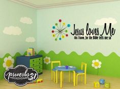 a child's room with a wall decal that says jesus loves me and flowers