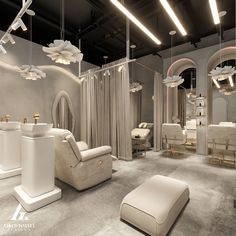 the interior of a hair salon with white furniture and mirrors hanging from the ceiling above