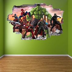 the avengers wall sticker is in an empty room with green walls and hardwood flooring