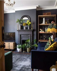 a living room filled with furniture and a fire place