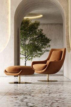 an orange lounge chair and ottoman in a room with a tree on the wall behind it