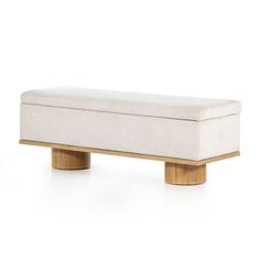 a white bench sitting on top of a wooden base