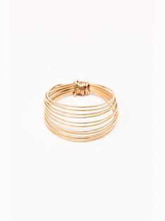 Meet the ring that started it all. The 14k Gold-Filled Go Ring is our best seller. Durable, yet dainty. Classic, yet on trend. This staple piece gives the illusion of 11 dainty bands in one ring. If you haven't, definitely read our story of how this ring came to be and the symbolism it carries. Spoiler alert: it's way more than just a ring. Handmade 14-karat Gold-Filled Hypoallergenic Non-tarnish Adventure-proof Thanks to our quality materials and craftsmanship, you'll have this thing for a long Dainty Rings, Permanent Jewelry, Handmade Jewelry Ring, Ring Collection, Diy Rings, Wire Rings, Wire Wrapped Rings