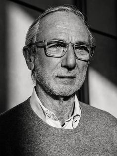 black and white photograph of an older man wearing glasses