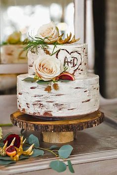 a white wedding cake with flowers on top