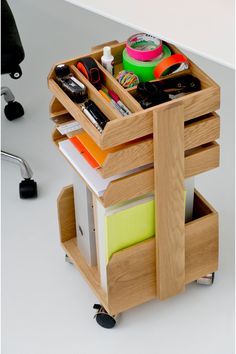 a wooden cart filled with lots of office supplies