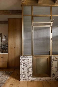 a bathroom with marble and wood accents in an old style house or hotel, italy