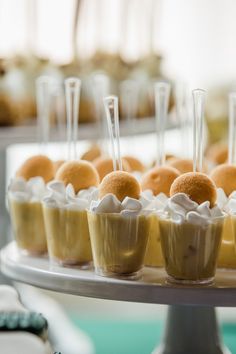 small desserts are arranged on a silver platter and ready to be served at an event