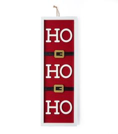 a sign that says ho hoo hanging from a hook on a white wall with red and black trim