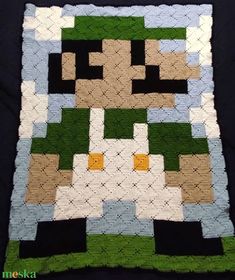 a close up of a quilt made to look like an image of mario kart