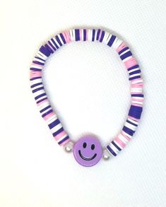 This bracelet is a perfect gift for any girl! So cute and purple! With a mix of pink and white is just so cute you won't want to take it off! Purple Bracelet Ideas, Pink Clay Bead Bracelet, Pink Clay Bead, Bracelet Clay Bead, Bracelet Preppy, Bracelet Clay, Keychains Ideas, Clay Bead Bracelet Ideas, Bead Bracelet Ideas