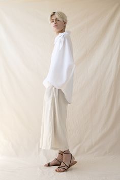 Unique white shirt, Minimalist natural linen shirt, Loose white shirt, Would make a perfect gift. A unique minimalist white kimono top. This turtleneck shirt is extremely comfortable, flattering and versatile. Made of pure linen and sewn with extreme precision by the hand of a tailor, this boho top features a fresh and trendy design that is perfect for you the free-spirited men & women. Wear this fresh and trendy top to any occasion and get ready to wow the crowds. ~ Returns and exchanges accept Loose White Shirt, Linen Oversized Shirt, Linen Wrap Top, Free Spirited Woman, White Kimono, Festival Pants, Minimalist White, Linen Shirts, Wrap Crop Tops