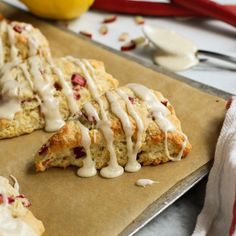 lemon scones with icing on a baking sheet