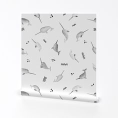 a white wallpaper with birds and seahorses on it's back side