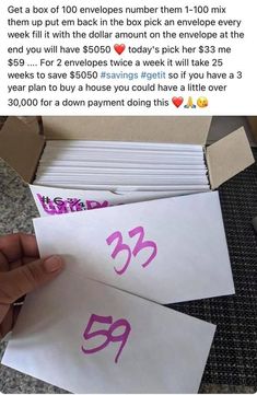 someone is holding up two envelopes with the number thirty three printed on them, which are both pink and purple