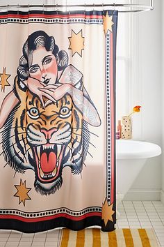 a shower curtain with an image of a woman and a tiger on it's face