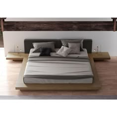 a bed sitting on top of a wooden platform