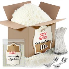 an open box filled with white rice next to silverware