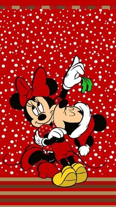 an image of mickey mouse with snow falling on it's face and feet, in front of a red background