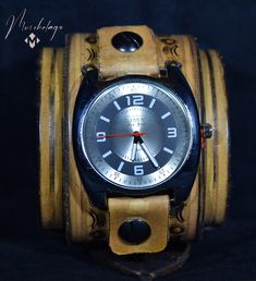 "Ivory Leather Cuff Watch, unisex elegant design, 2.5 inches width, fits 6.5 & 7.5 inches wrist, dyed in antique beige, stamped and designed, made of American vegetable tanned leather, and polished and finished with the waxed top coat to give it a vintage look. Item includes watch face and is removable and interchangeable. Upon request can be made to your size in a different color of your choice. Completely handmade using traditional tools and techniques. This is a \"One of a Kind \"original wor Leather Cuff Watch Band, Vintage Cuff Watch With Leather Strap, Vintage Adjustable Cuff Watch, Vintage Cuff Bracelet Strap Watch Accessories, Cuff Bracelet Strap Watches, Handmade Adjustable Brown Watch, Handmade Brown Adjustable Watch, Vintage Cuff Watch Band As Gift, Vintage Cuff Watch