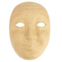 a wooden mask with two eyes on a white background