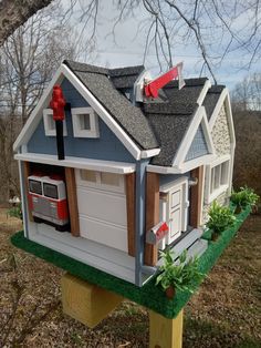 a toy house with two garages on the roof