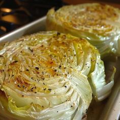 two pieces of cabbage sitting on top of a pan