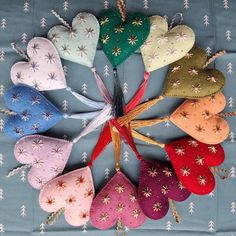 several heart shaped ornaments are arranged in a circle