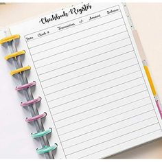 a notepad and pen sitting on top of a desk