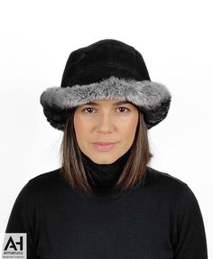 A very fashionable and elegant cloche style hat for women made with very soft rex orylag & black suede sheepskin. Easy to wear and nicely combined materials bring a completeness and an harmory. A hat that can keep you warm and stylish at the same time. Practical and fashionable , this particular hat can be worn in any possible way due to its large brim. This cloche style sheepskin hat is made with 2-sided sheepskin (shearling sheepskin or double face sheepskin). The exterior side has durable bla Winter Fur Felt Brimmed Cloche Hat, Winter Brimmed Fur Felt Cloche Hat, Brimmed Fur Felt Cloche Hat For Winter, Winter Brimmed Cloche Hat In Fur Felt, Winter Fur Felt Cloche Hat With Short Brim, Luxury Adjustable Winter Hat, Black Hat With Faux Fur Lining, Luxury Winter Hats With Short Brim, Luxury Winter Hats With Faux Fur Lining