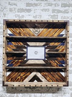 a wooden wall hanging on the side of a building