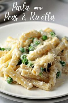 pasta with peas and ricotta on a white plate