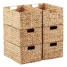 three woven storage baskets with handles are stacked on top of each other and one is empty