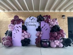 balloon arch with bats and balloons for a baby's brewing party