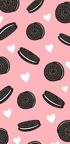 cookies and hearts on a pink background with black and white outlines in the shape of hearts