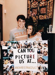 a man and woman standing next to each other holding a sign that says can you picture us at