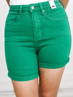 Meet your new favorite summer staple - the Judy Blue High Waist Tummy Control Kelly Green Garment Dyed Shorts. Designed with a high waist and tummy control technology, these shorts provide a flattering fit and added confidence. The vibrant kelly green color adds a pop of color to any outfit. Made from 91% Cotton, 7% Polyester, 2% Spandex FRONT RISE: 11, INSEAM: 4 / 6 (cuffed/ uncuffed) Small fits sizes: 2-4 Medium fits sizes: 6-8 Large fits sizes: 10-12 XL fits sizes: 13-15 1XL fits sizes: 14W-1 Relaxed Fit Biker Shorts For Spring, Stretch High-waisted Bermuda Shorts For Summer, Summer Cotton Bermuda Shorts With Mid-thigh Length, Summer Cotton Bermuda Shorts Mid-thigh Length, Stretch Bermuda Shorts For Summer, Trendy Green Relaxed Fit Shorts, Spring Cotton Bermuda Shorts Mid-thigh Length, Green Summer Jean Shorts, Green Bermuda Shorts With Built-in Shorts For Summer