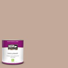 the behr paint and primer in one is shown on a dark red background