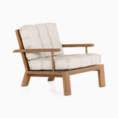 a chair that is made out of wood and has a cushion on the armrest